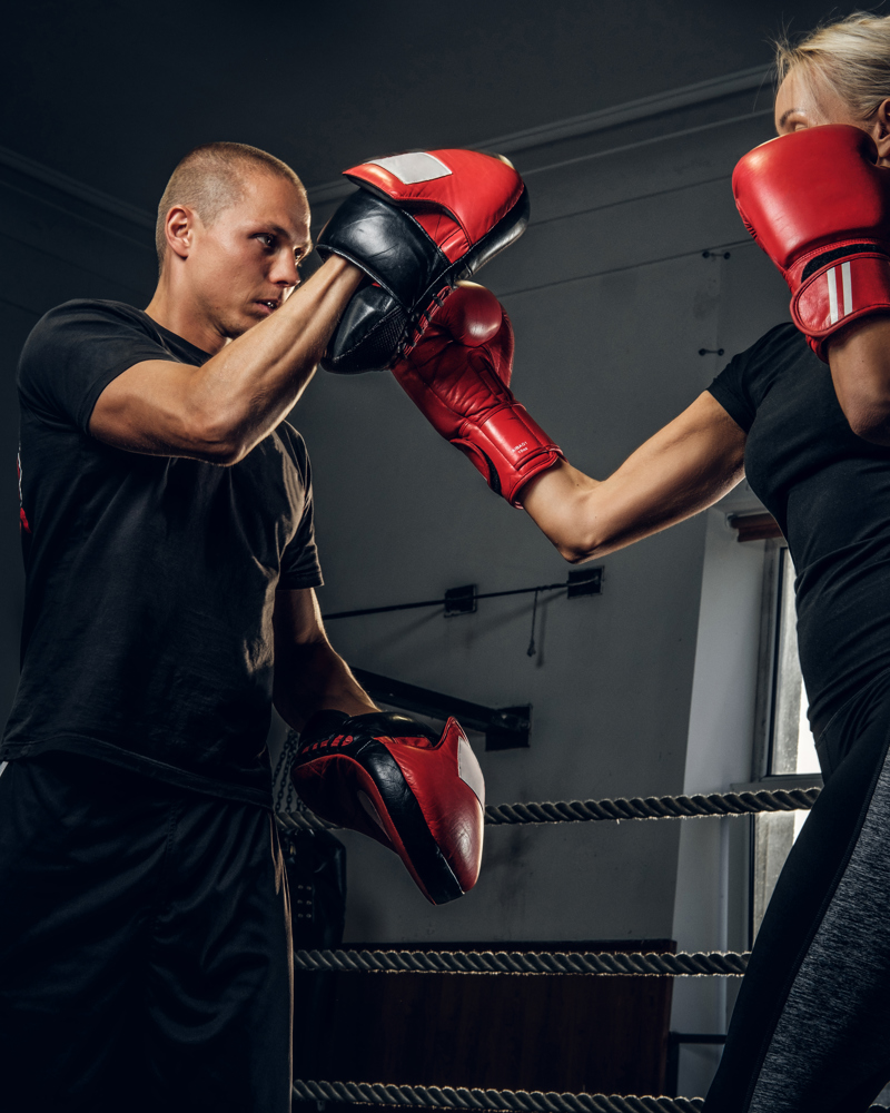 Sportive Blond Woman Has Boxing Training With Her Experienced Trainer